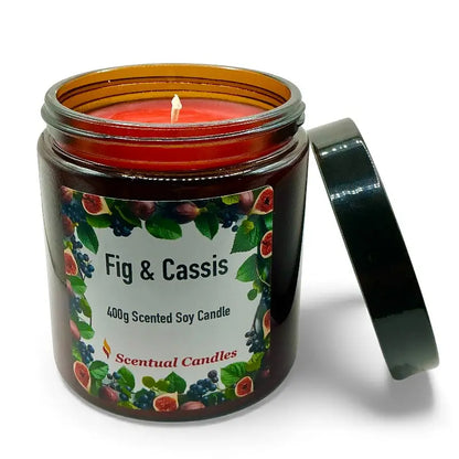 Fig and Cassis scented soy candle in a glass jar with open lid, showcasing rich, sun-kissed aroma and elegant botanical notes.