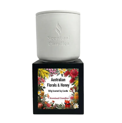 Australian Florals and Honey scented soy candle displayed in elegant packaging from Scentual Candles.