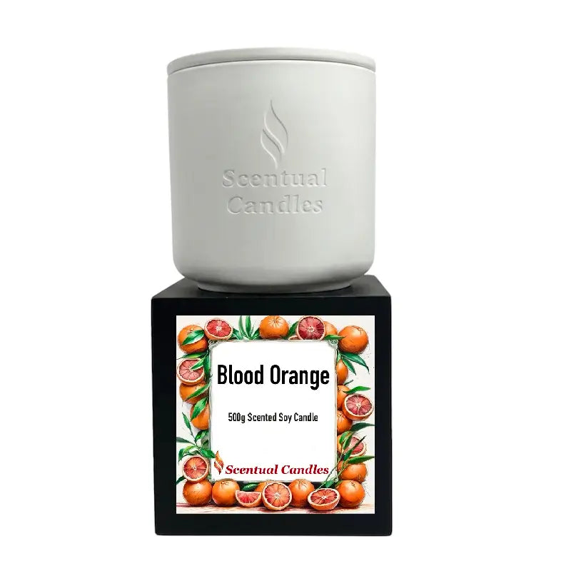 Blood Orange Candle by Scentual Candles, 500g scented soy candle in a white container with a vibrant label.