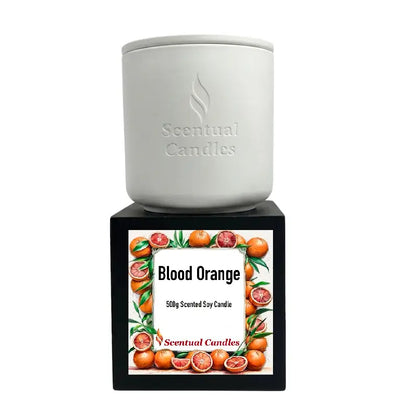 Blood Orange Candle by Scentual Candles, 500g scented soy candle in a white container with a vibrant label.