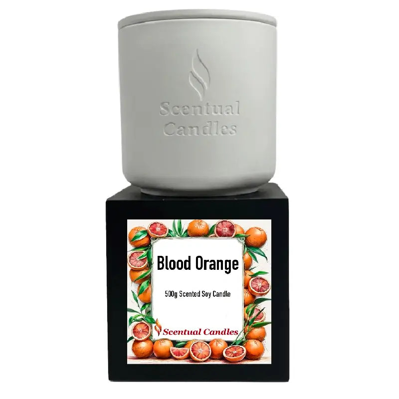 Blood Orange Candle by Scentual Candles, 500g scented soy candle in a white container with a vibrant label.