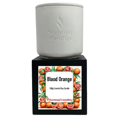 Blood Orange Candle by Scentual Candles, 500g scented soy candle in a white container with a vibrant label.