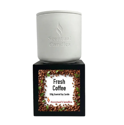 Coffee Scented Candle in a white container with a Fresh Coffee label on a black box, perfect for cozy ambiance.