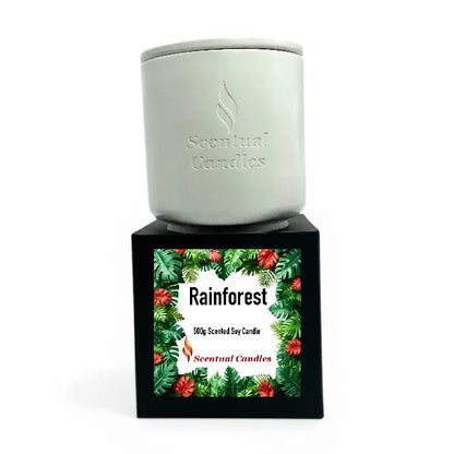 Rainforest Scented Candle in a stylish container, showcasing a lush floral design and branding from Scentual Candles.