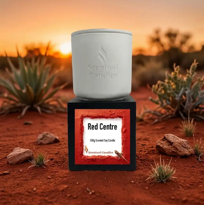 Spicy Vanilla and Buddhawood 'Red Centre' Candle in a white container on a black base.