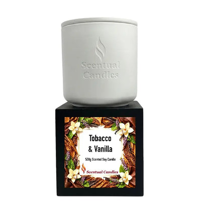 Tobacco Scented Candle displayed in a minimalistic white container with a decorative label featuring floral elements.