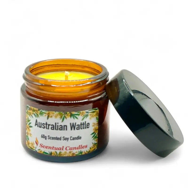 Australian Wattle Scented Soy Candle in amber glass jar with open lid, part of Australian Scents Collection by Scentual Candles.