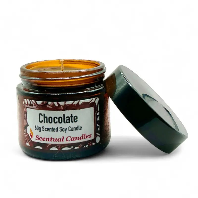 Chocolate candle in a jar with an open lid on a white background