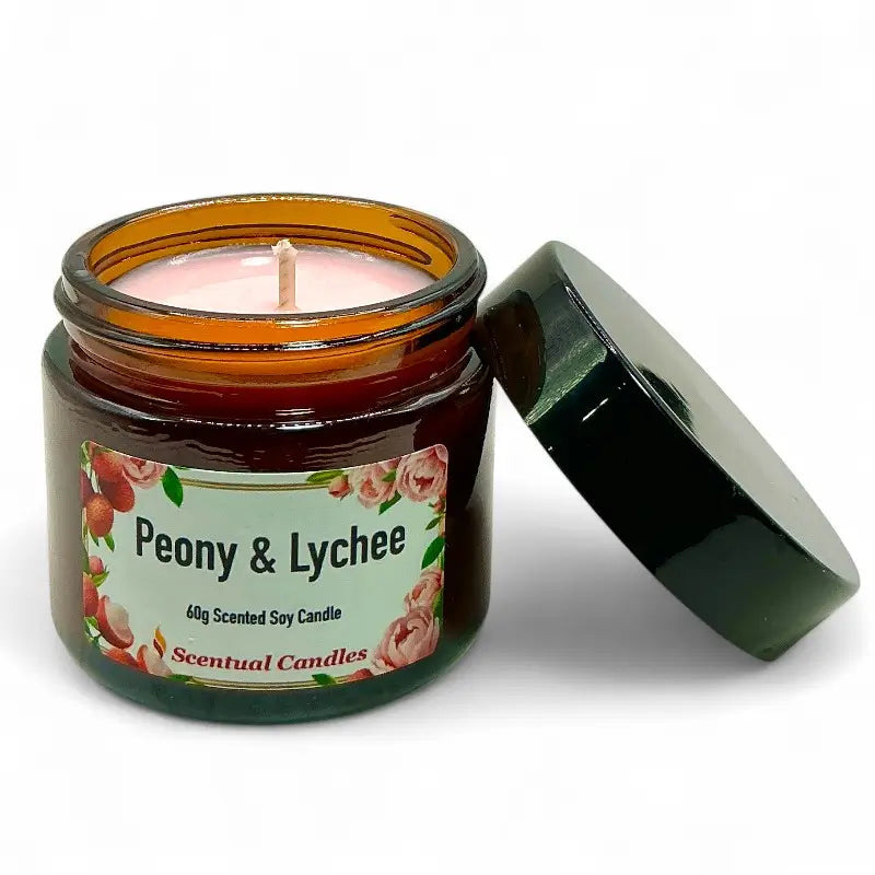 Peony and Lychee scented candle in amber jar, labeled as Scentual Candles. Focus keyword: Lychee Scented Candle.