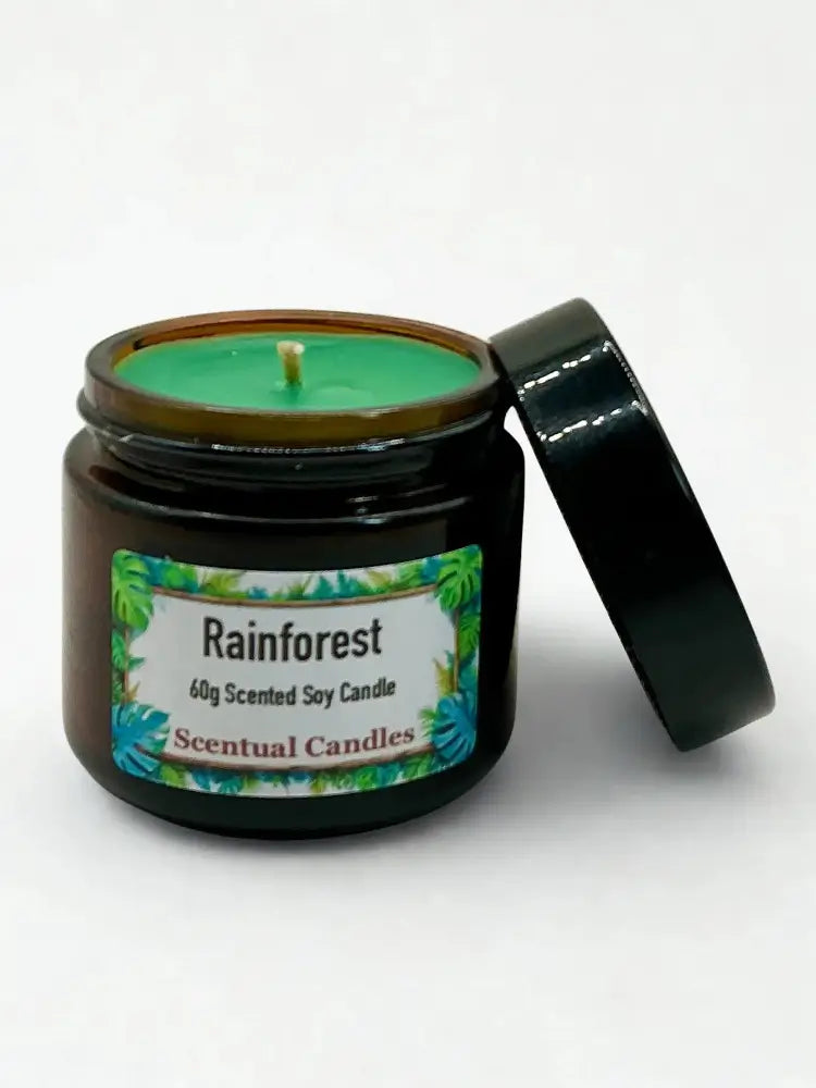 Black candle jar labeled 'Rainforest' with a white background