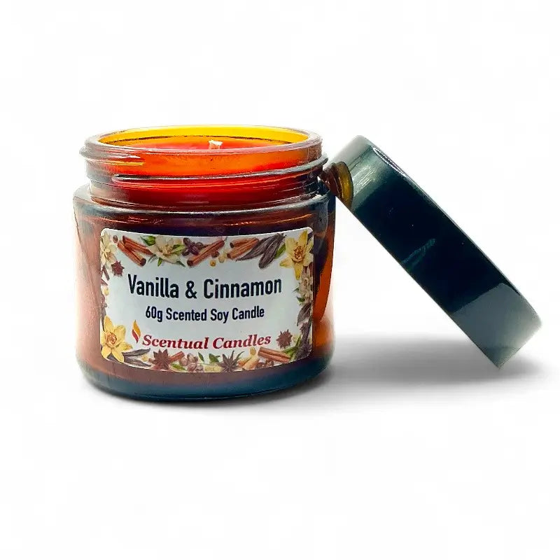 Vanilla and Cinnamon Candle scented soy in a jar with open lid, showcasing rich spice and creamy vanilla aroma for a cozy experience.