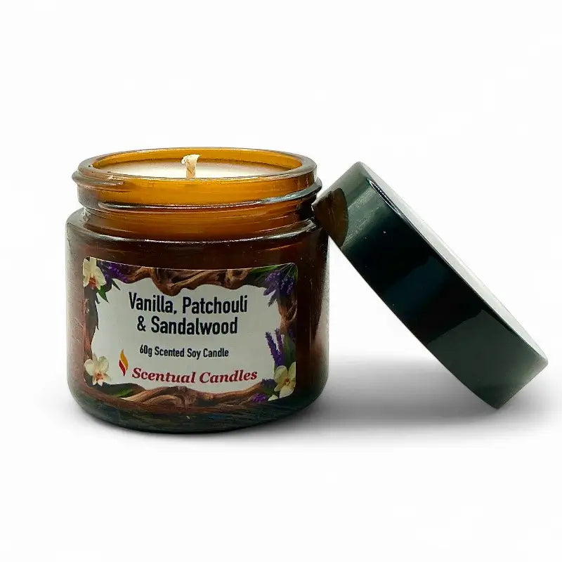 Scentual Candles vanilla patchouli and sandalwood candle in amber jar with green lid on white background