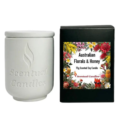Australian Florals and Honey scented soy candle in white container with black packaging.