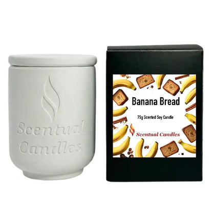 Banana Bread Candle in a white jar with packaging featuring banana and bread illustrations.