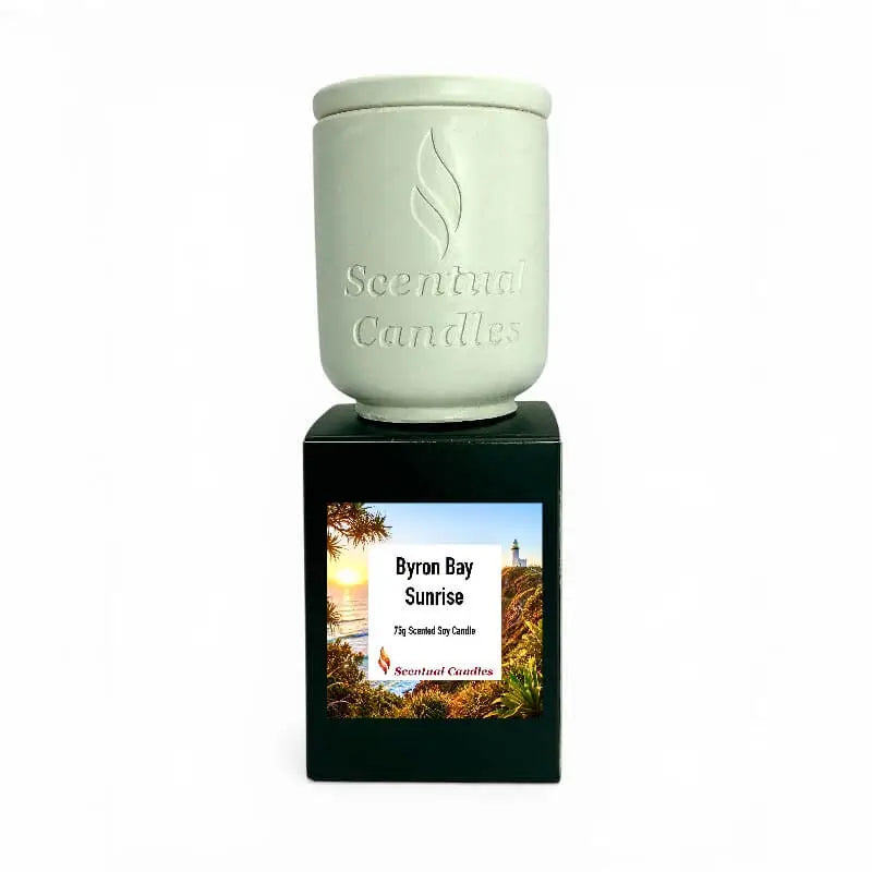 Byron Bay Scented Soy Candle in a decorative container, showcasing the Byron Bay Sunrise label with coastal imagery.