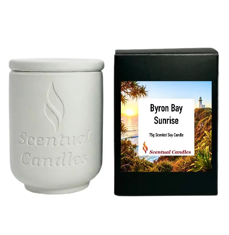 Byron Bay Scented Soy Candle in white container with packaging featuring beautiful coastal view and branding.