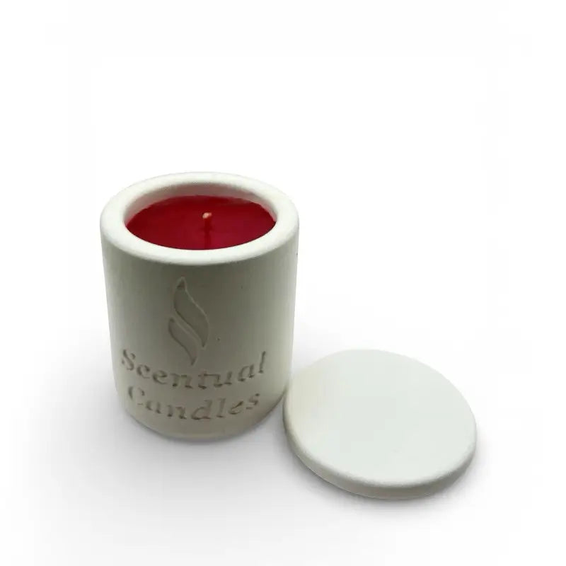 Spicy Vanilla candle with red wax and lid on a white background