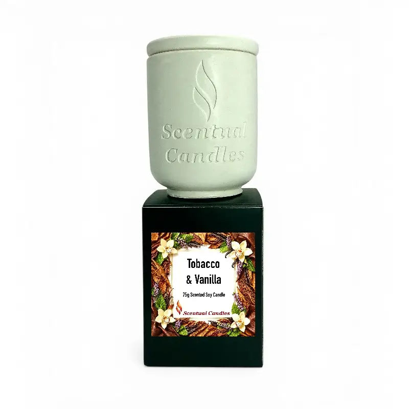 Tobacco Scented Candle in a decorative container with a label showcasing tobacco and vanilla fragrance.