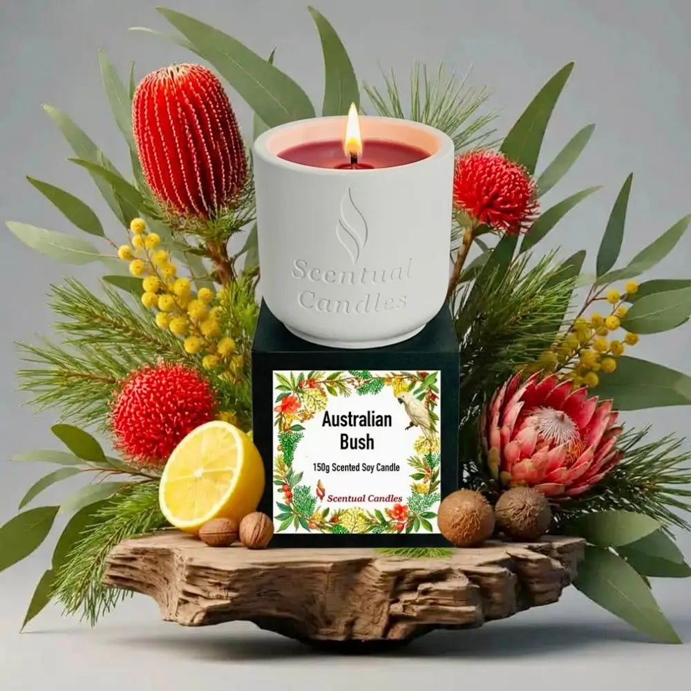 Australian Bush Candle displayed with native plants, lemon, and earthy elements on a wooden base.