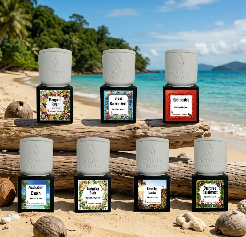 Australian Destinations Candle Set featuring seven scented candles inspired by iconic Australian locations on a beach.