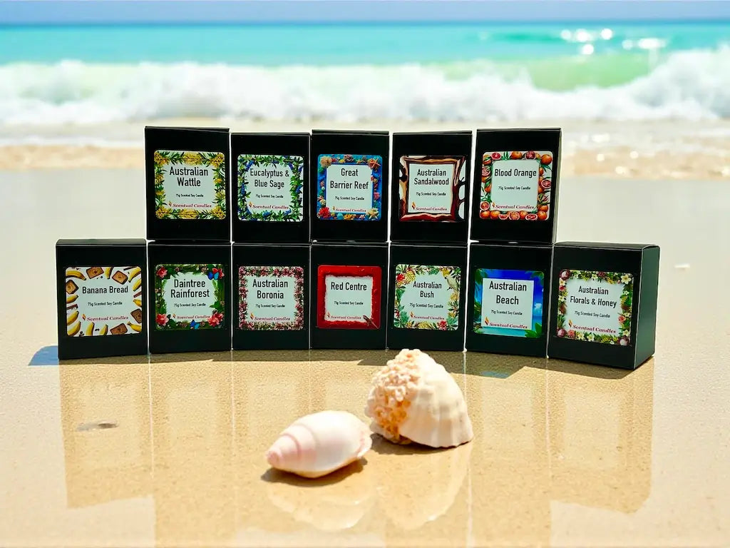 Australiana Candle Set featuring 12 Australian scents displayed on a sandy beach.