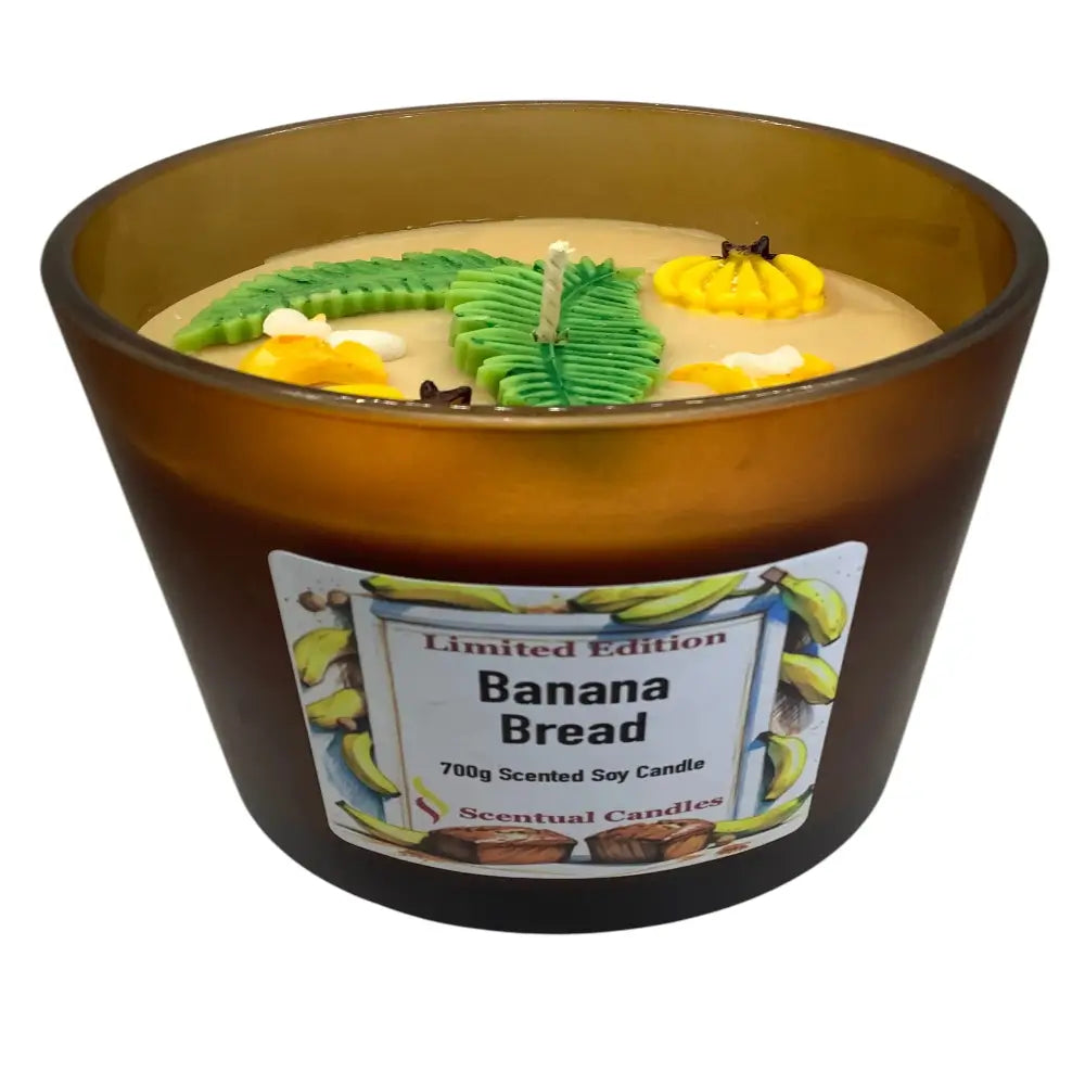 Banana bread-themed candle with decorative elements and a label on a white background