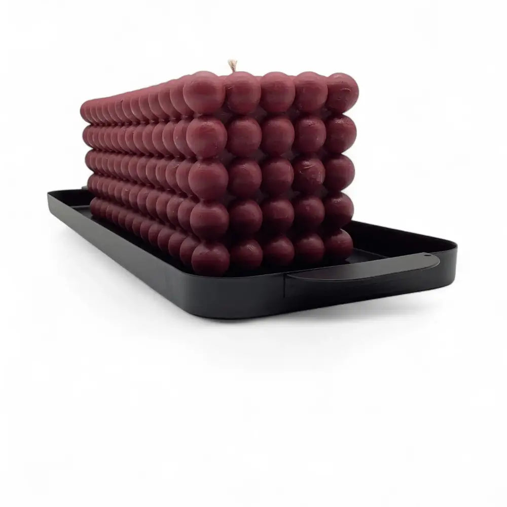Candle Tray in large black metal, displaying an oversized statement candle, 39cm. Ideal for modern home decor and durable functionality.