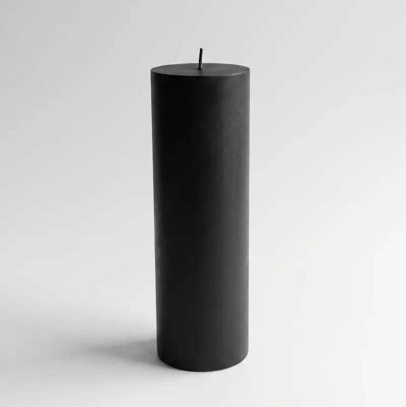Big Candle in bold black color, oversized pillar design, perfect for striking décor and long-lasting fragrance.