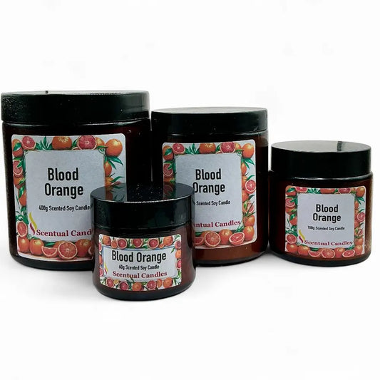 Four 'Blood Orange' scented candles with decorative labels on a white background