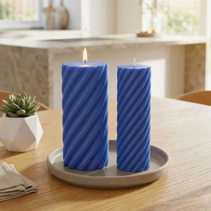 Pillar Candle Set featuring two spiral columns on a table, showcasing blue twisted candles as elegant decor.