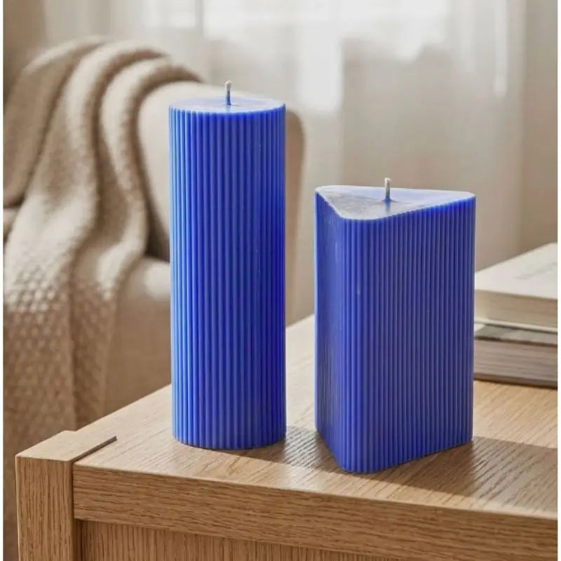 Geometric Pillar Candle Set featuring blue ribbed triangle and column candles for a stylish home decor accent.