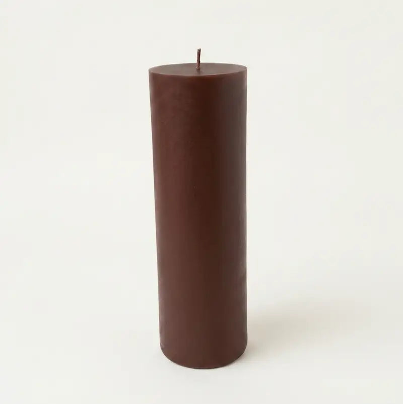 Big Candle in a rich brown color, showcasing its tall and elegant pillar design.