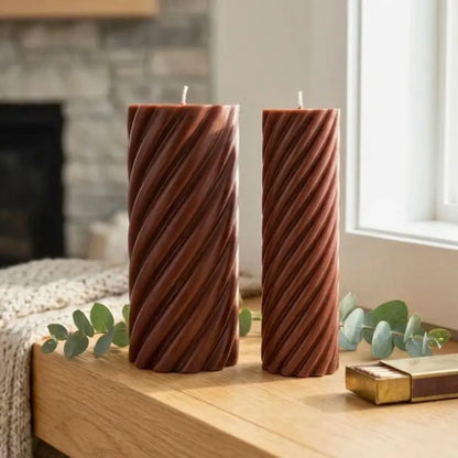 Pillar Candle Set featuring two spiral columns, one large and one slim, showcasing their decorative design on a wooden table.