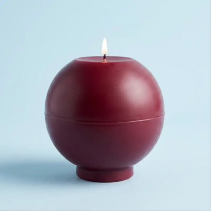 Round Candle in deep red color, oversized and customizable, designed to be an eye-catching centerpiece.