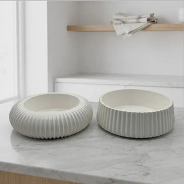 Candle Holder - Decorative Set of 2 showcasing white ceramic holders on a marble surface.