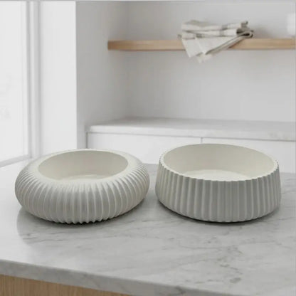 Candle Holder - Decorative Set of 2 showcasing white ceramic holders on a marble surface.