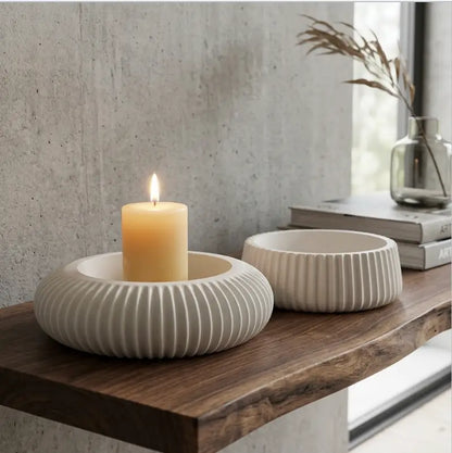 Candle Holder - Decorative Set of 2 featuring white ribbed designs, perfect for larger pillar candles on a wooden shelf.