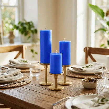 Candles for Dinner - Set of 3 blue pillar candles on a wooden dining table for a cozy ambiance.