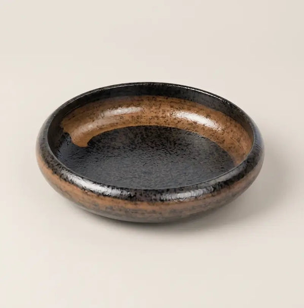 Ceramic Candle Holder Plate 14cm in black and brown, showcasing an elegant design for candle display.