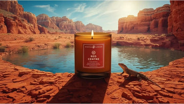 Spicy Vanilla Candle with a 'Red Centre' label in a desert landscape with a lizard and water body.