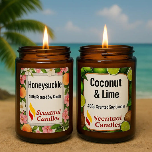 Two scented candles with labels 'Honeysuckle' and 'Coconut & Lime' on a beach background.