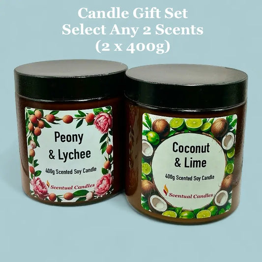 Two scented candles with labels for 'Peony & Lychee' and 'Coconut & Lime' on a light blue background.