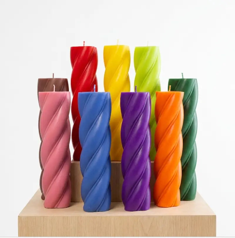 Customisable Candle - Extra Large Column in various colors on display, showcasing unique twist design.