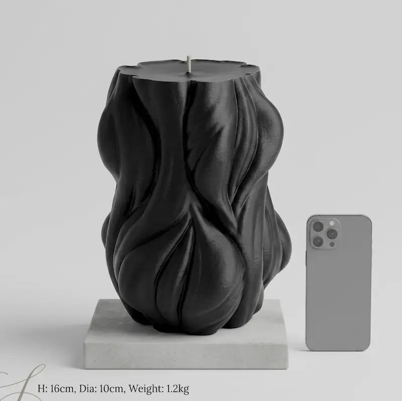 Decorative Candle 1.2kg in unique design, 16cm tall, displayed with smartphone for size reference.