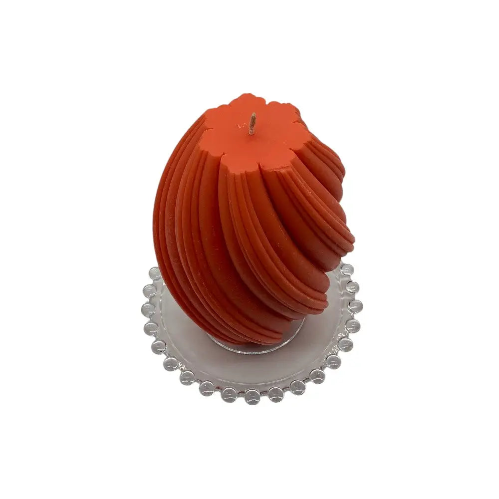 Blood Orange candle on a decorative glass candle plate with a white background