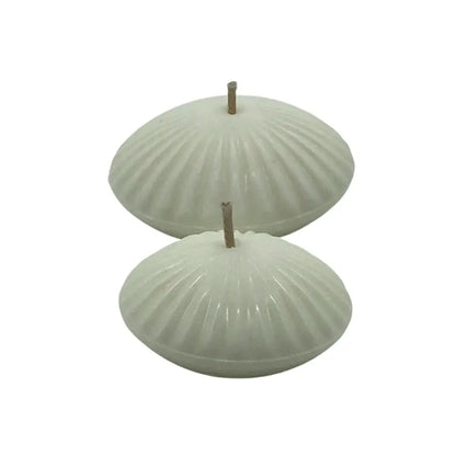 two white floating candles side by side