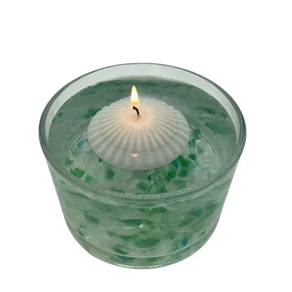Floating Candles in a glass container of water on a white background