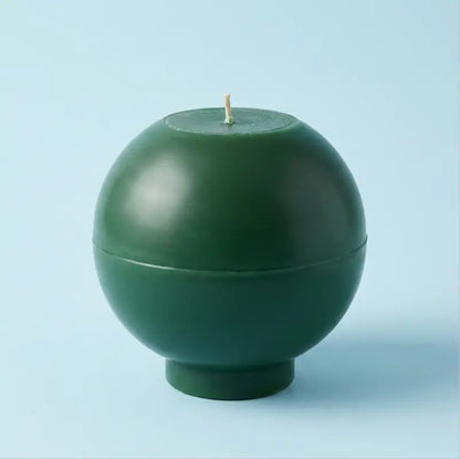 Round Candle in dark green color with a smooth spherical design and wick. Ideal for customisable colour and scent.