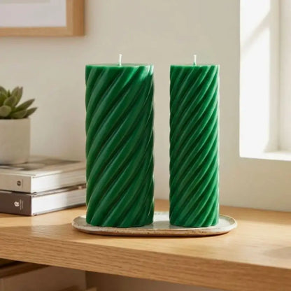 Pillar Candle Set featuring two green spiral columns on a wooden table, ideal for home decor and ambiance.