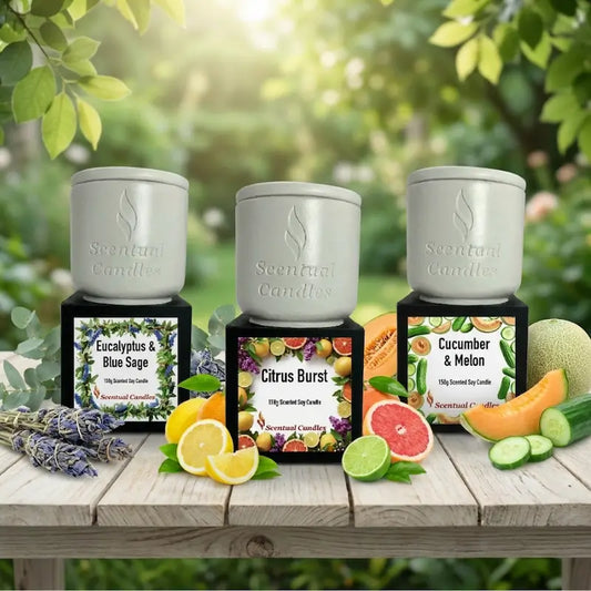 Fresh Scented Candle Set with Eucalyptus & Blue Sage, Citrus Burst, and Cucumber & Melon on a wooden table.